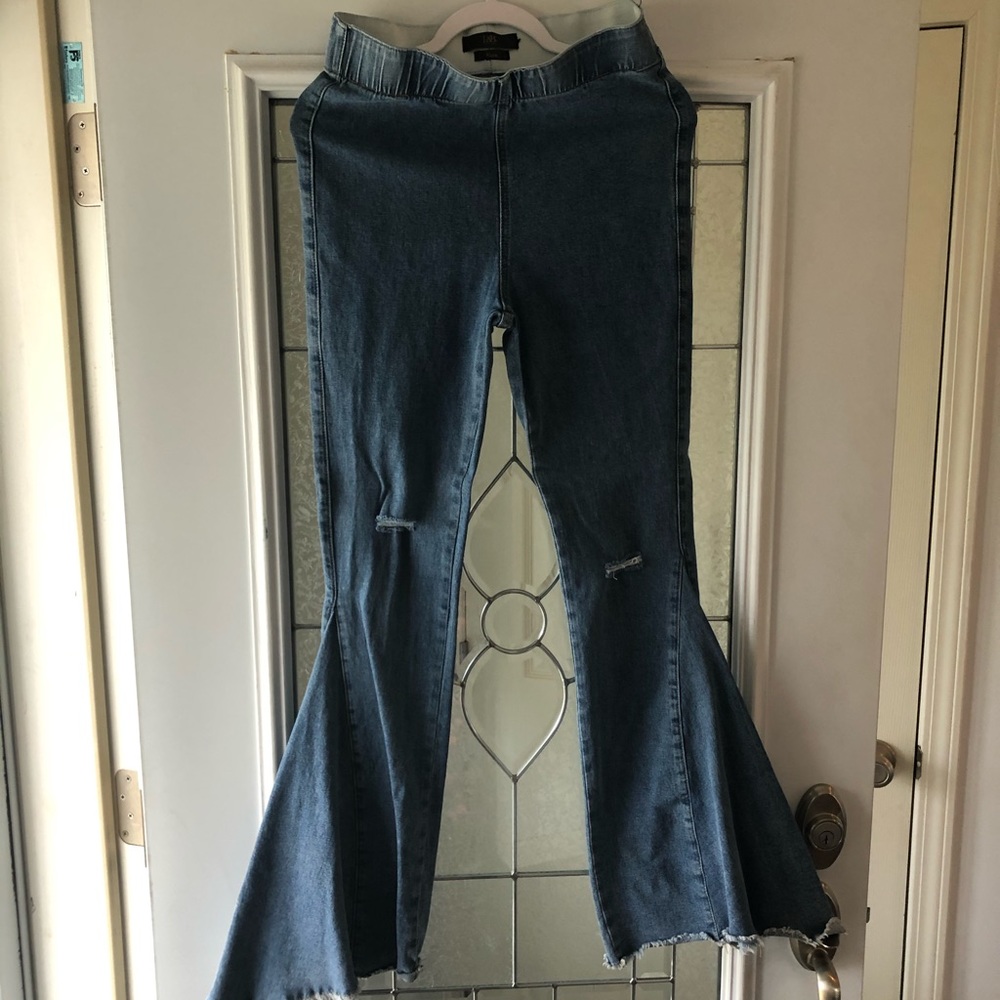 Distressed super flare jeans